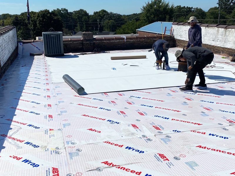 Weatherguard Roofing & Restoration | Weatherguard team installing a new roof on a commercial building