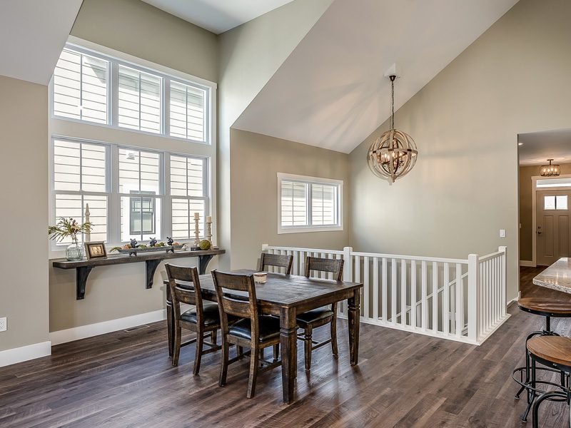 Weatherguard Roofing & Restoration | A freshly painted dining room and kitchen area of a home restored due to storm damage and a leaky roof