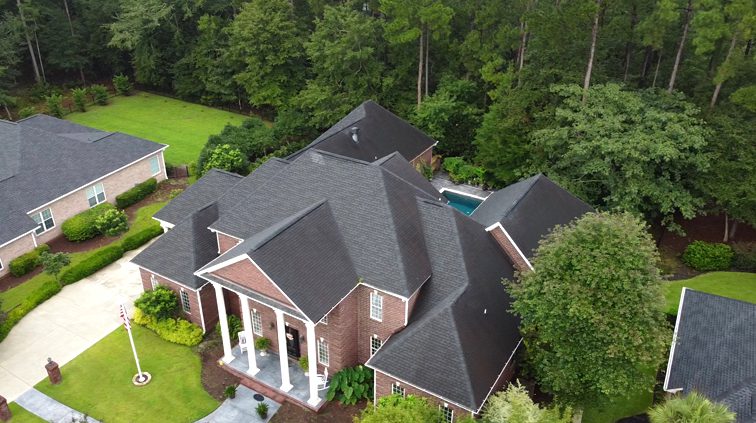 Weatherguard Roofing & Restoration | A new roof with asphalt shingles fully installed on a luxury home that was damaged by a storm